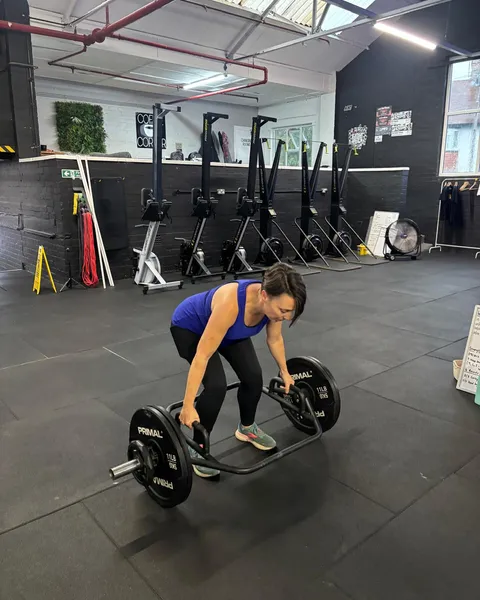 A client deadlifting in the gym