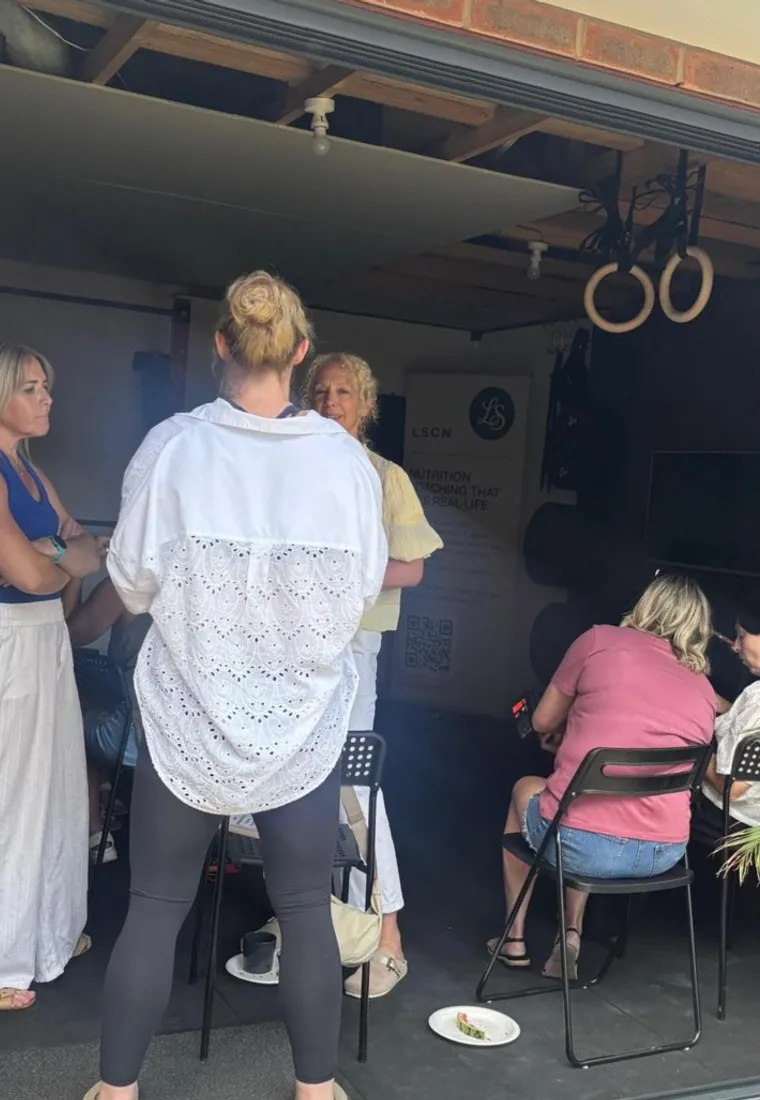 Lesley talking with a group of women
